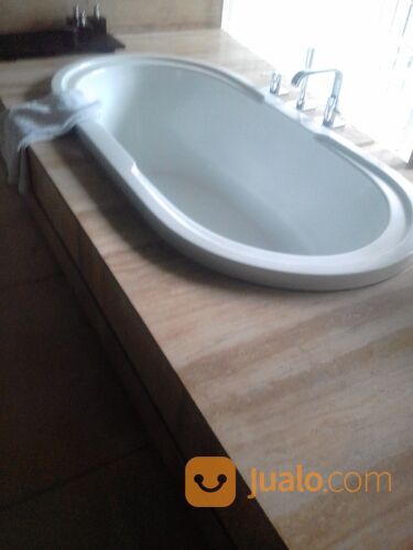 Pasang dan poles batu alam