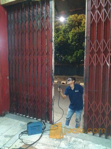 Biaya service/reparasi pintu harmonika & Rolling door Jakarta Selatan