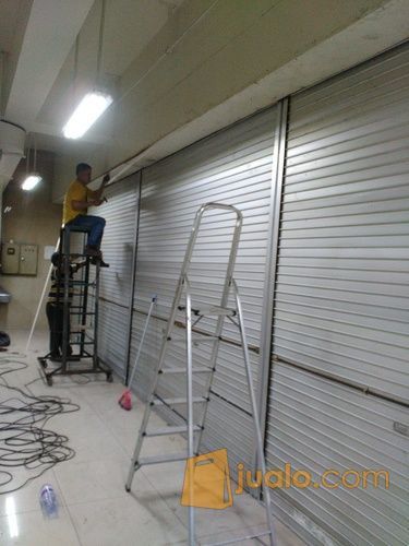 Biaya service/reparasi pintu harmonika & Rolling door Jakarta Selatan